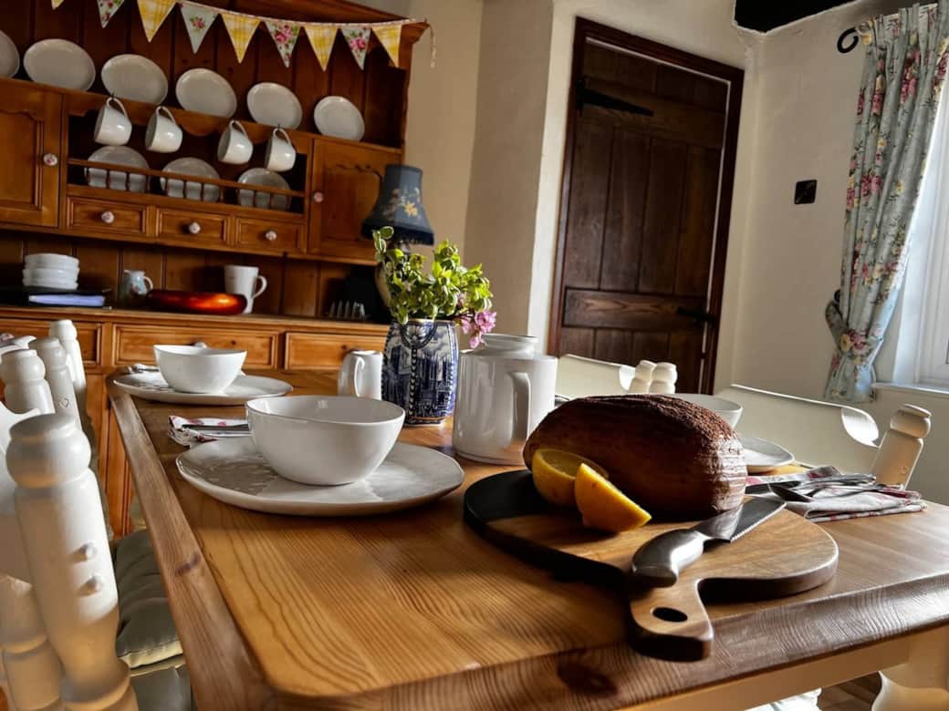 Country dining nook with a pine dresser and large farmhouse table